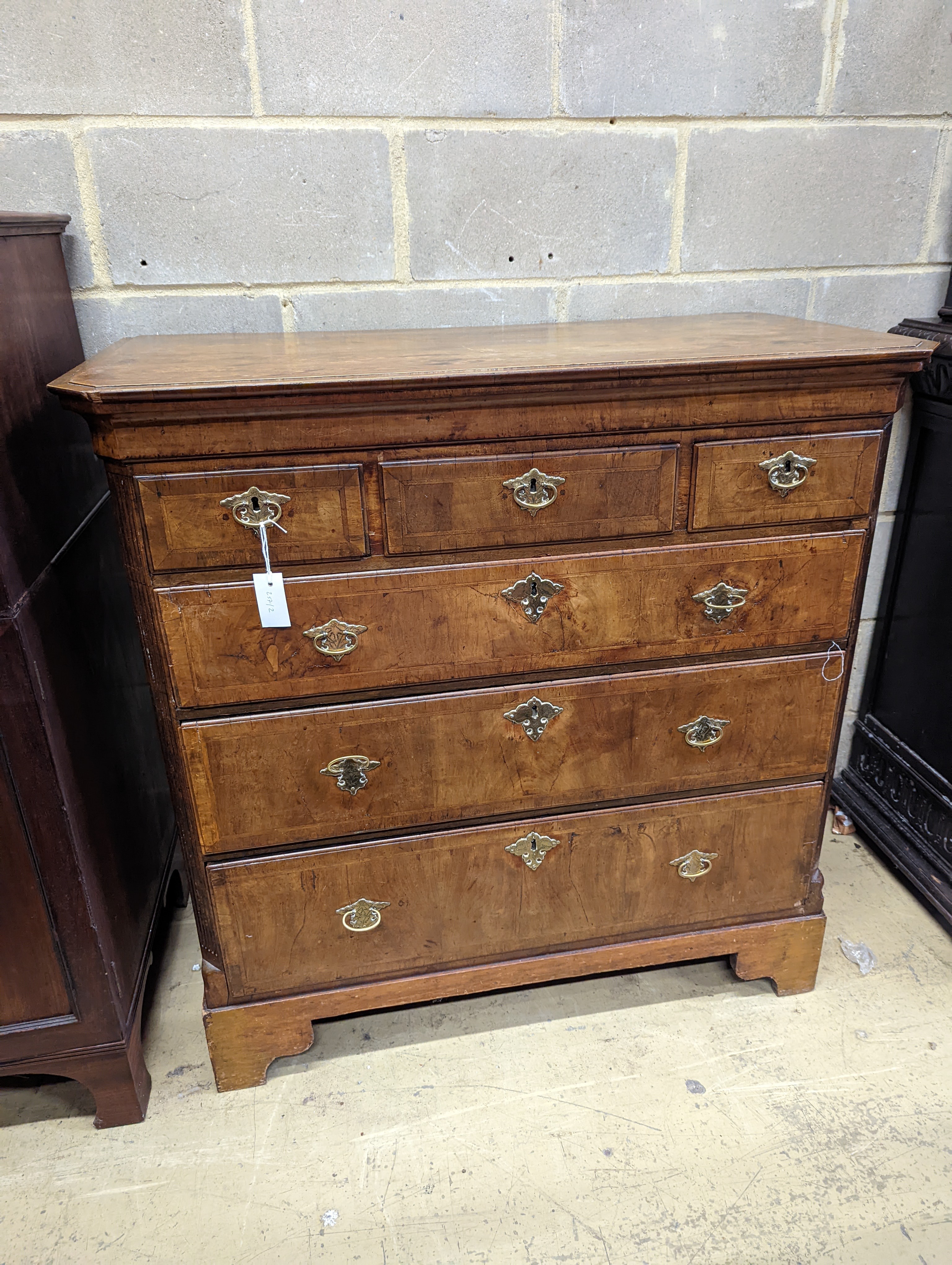 An 18th century and later walnut chest, (formerly a tallboy section) width 107cm, depth 54cm, height 107cm